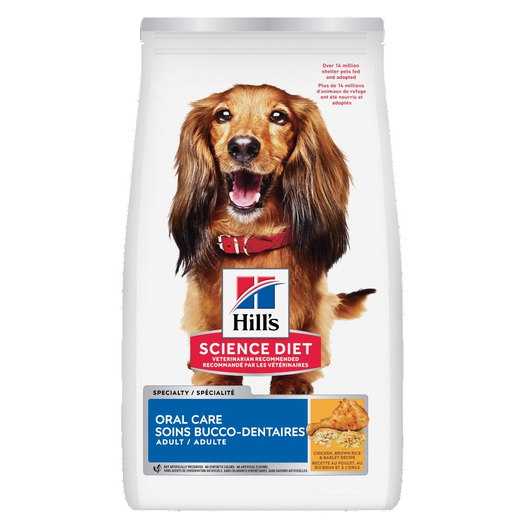 A bag of Hill's Science Diet adult dog food, specifically the Oral Care variety. The packaging is white with a large photo of a brown dachshund wearing a red collar, and features a blue and red logo block in the center.